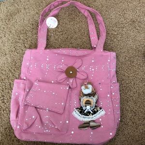 cute light pink handbag with pockets and doll